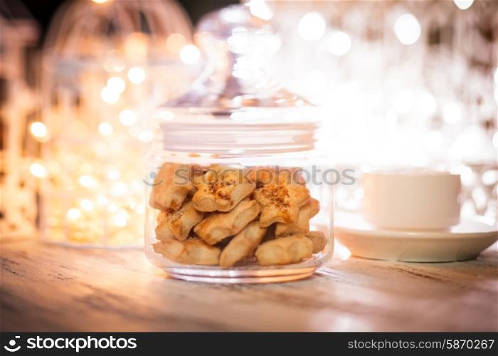 Holiday cookies over defocused light in cages