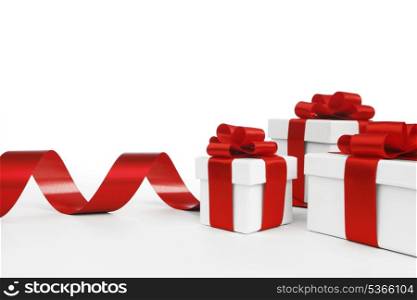 Holiday gifts decorated with red ribbon on white background