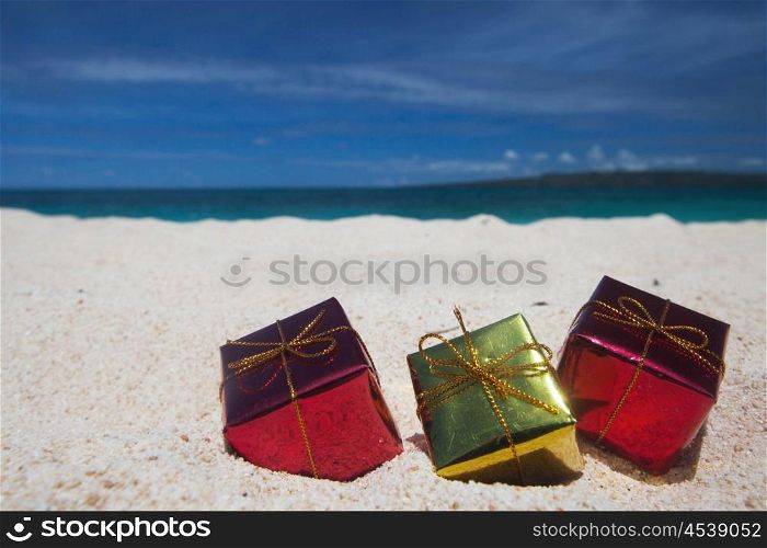 Holiday gifts on beach. Holiday gifts on the sand of tropical sea beach
