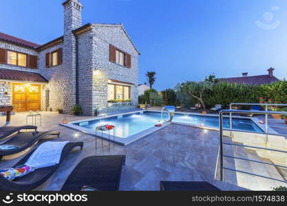 holiday home with swiiming pool at night