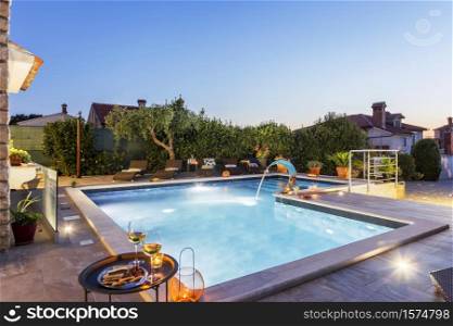 holiday home with swimming pool at dusk