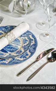 Holiday place setting with napkin, fork and knife