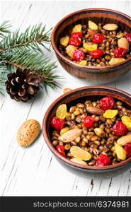 holiday porridge with nuts and raisins. national Russian Christmas dish, a porridge with raisins and almonds, kutya
