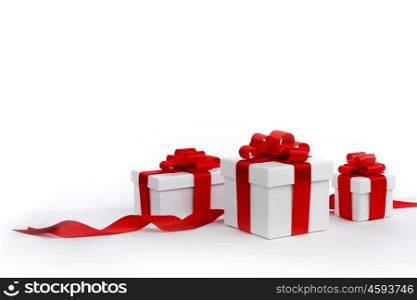 Holiday presents wrapped in white paper with red ribbons, isolated on white