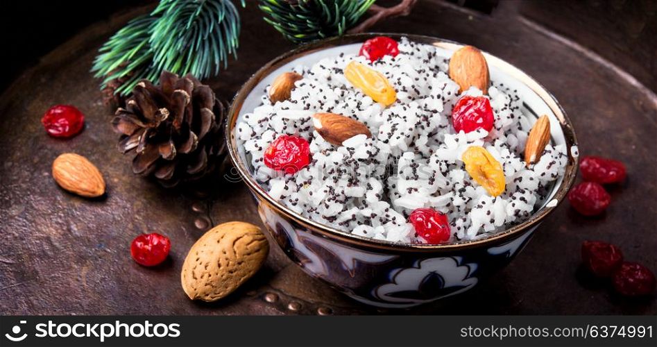 holiday rice porridge with nuts and raisins. national Russian Christmas dish, a porridge with raisins and almonds, kutya