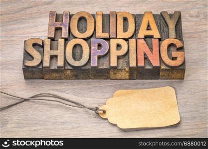 holiday shopping word abstract in vintage letterpress wood type with a blank price tag