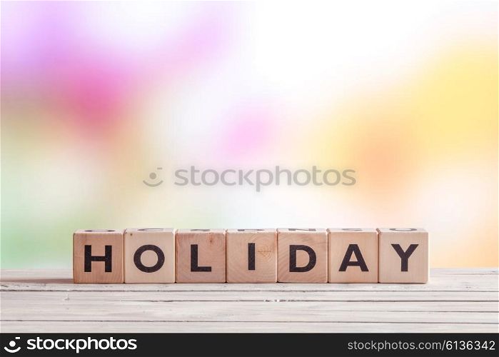 Holiday sign made of cubes on a wooden table