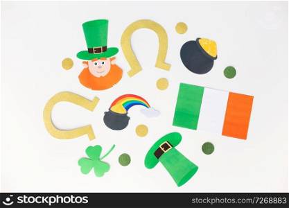 holidays and celebration concept - st patricks day decorations or party props made of paper on white background. st patricks day decorations on white background