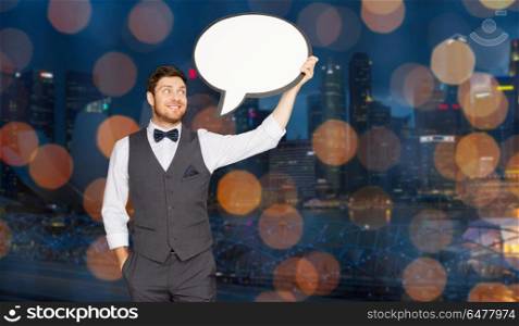 holidays and communication concept - happy man in suit holding blank text bubble banner over singapore city night lights background. man with blank text bubble over singapore city. man with blank text bubble over singapore city