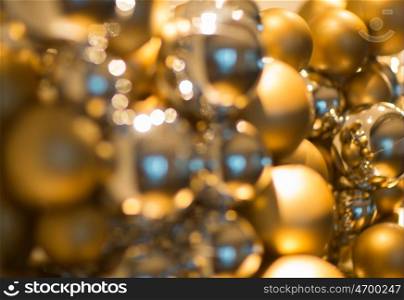 holidays and luxury concept - golden christmas decoration or garland of beads or balls. golden christmas decoration or garland of beads