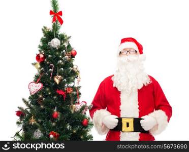 holidays and people concept concept - man in costume of santa claus with christmas tree