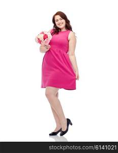 holidays and people concept - smiling happy young plus size woman with flower bunch posing in pink dress. happy young plus size woman with flower bunch
