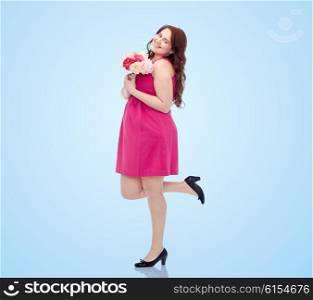 holidays and people concept - smiling happy young plus size woman with flower bunch posing in pink dress over blue background. happy young plus size woman with flower bunch