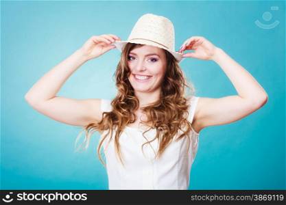 Holidays and summer fashion. Closeup girl in straw hat. Portrait of charming woman long curly hair.