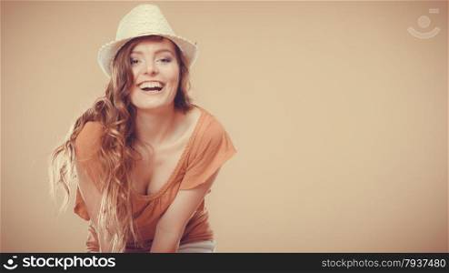 Holidays and summer fashion. Girl in fashionable clothes straw hat laughing. Portrait of charming woman tourist
