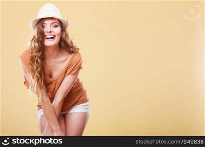 Holidays and summer fashion. Girl in fashionable clothes straw hat laughing. Portrait of charming woman tourist
