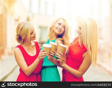 holidays and tourism, friends, blonde girls concept - beautiful women with takeaway coffee cups in the city