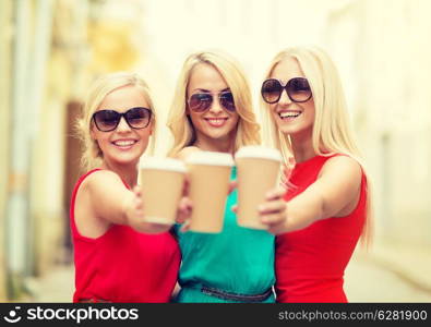 holidays and tourism, friends, blonde girls concept - beautiful women with takeaway coffee cups in the city