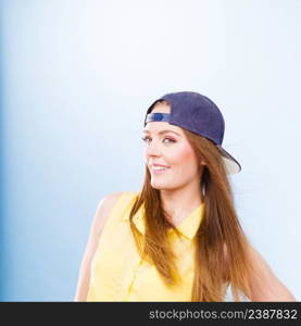 Holidays and vacation. Lovely trendy urban style girl in jeans cap. Portrait of long haired smiling attractive teenage woman.. Portrait of joyful trendy girl.