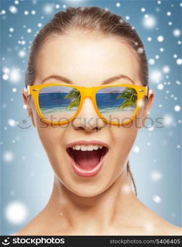 holidays, beauty and happiness - amazed girl in shades with beach reflection