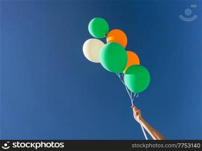 holidays, birthday and party decoration concept - close up of inflated helium balloons in blue sky. close up of helium balloons over blue sky