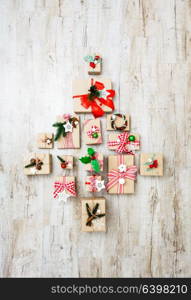 Holidays boxes in shape of Cristmas tree. Christmas craft boxes