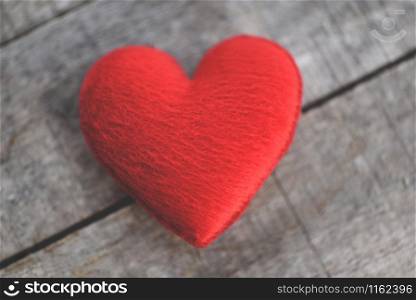 Holidays card Valentines day red heart on old wood for philanthropy concept / Hearts on a wooden background donate help give love take care
