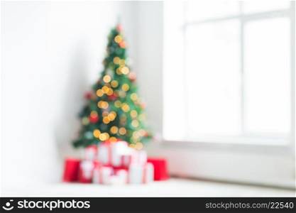 holidays, celebration and home concept - living room with christmas tree and presents background