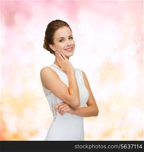 holidays, celebration, wedding and people concept - smiling woman in white dress wearing diamond ring over pink lights background