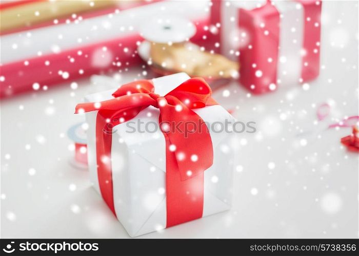 holidays, decoration and celebration concept - close up of christmas present on table