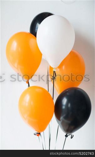 holidays, decoration and party concept - bunch of air balloons for halloween or birthday over white background. air balloons for halloween or birthday party