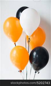 holidays, decoration and party concept - bunch of air balloons for halloween or birthday over white background. air balloons for halloween or birthday party