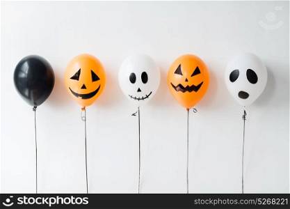 holidays, decoration and party concept - scary air balloons for halloween over white background. scary air balloons decoration for halloween party