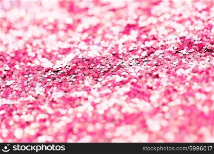 holidays, decoration and texture concept - pink glitter or sequins background