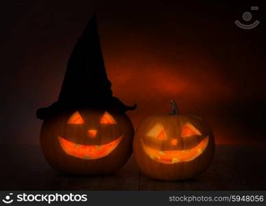 holidays, halloween and decoration concept - close up of pumpkins on table