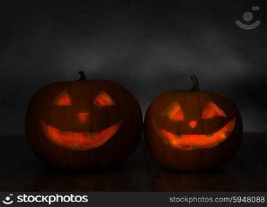 holidays, halloween and decoration concept - close up of pumpkins on table