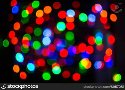 Holidays lights background. Bokeh background. Lightbulb background. Holidays lights background