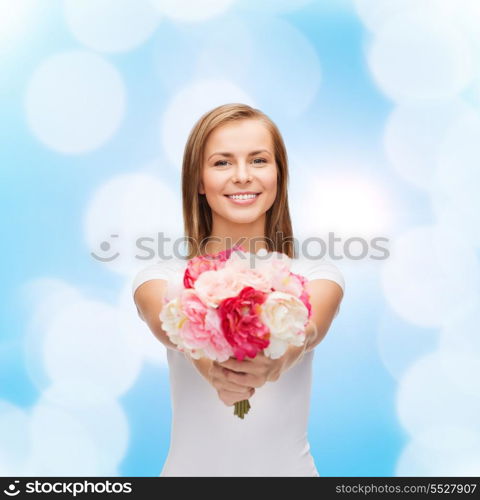 holidays, love and flowers concept - young woman with bouquet of flowers