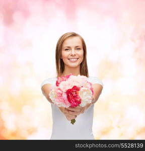 holidays, love and flowers concept - young woman with bouquet of flowers