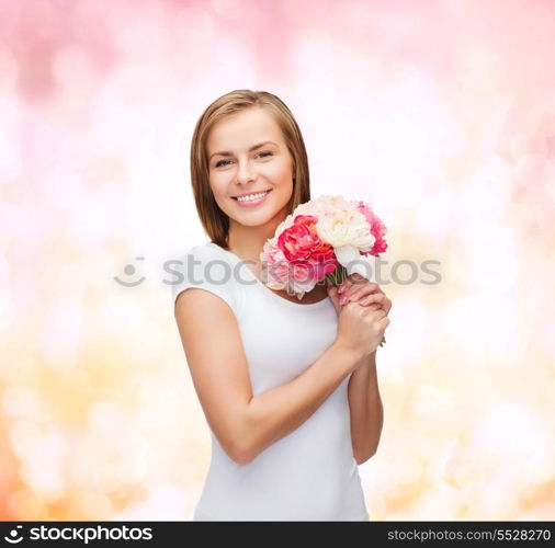 holidays, love and flowers concept - young woman with bouquet of flowers