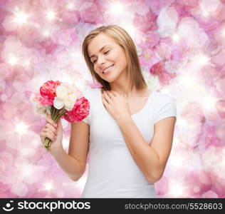 holidays, love and flowers concept - young woman with bouquet of flowers