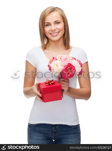 holidays, love and flowers concept - young woman with bouquet of flowers and red gift box