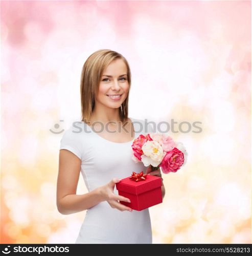 holidays, love and flowers concept - young woman with bouquet of flowers and red gift box
