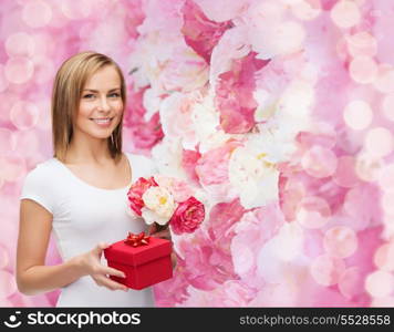 holidays, love and flowers concept - young woman with bouquet of flowers and red gift box