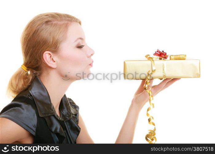 Holidays love and happiness concept - beautiful blonde girl with golden gift box blowing a kiss isolated