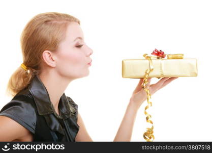 Holidays love and happiness concept - beautiful blonde girl with golden gift box blowing a kiss isolated