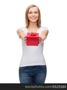 holidays, love and happiness concept - beautiful girl with gift box