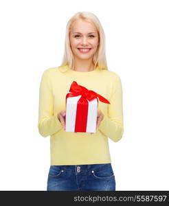 holidays, love and happiness concept - beautiful girl with gift box