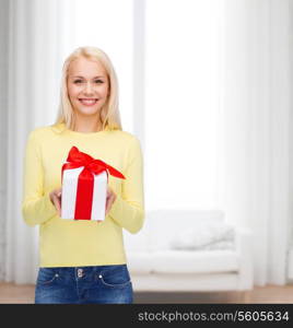 holidays, love and happiness concept - beautiful girl with gift box