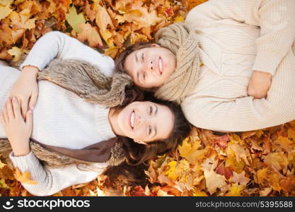 holidays, love, travel, tourism, relationship and dating concept - romantic couple in the autumn park